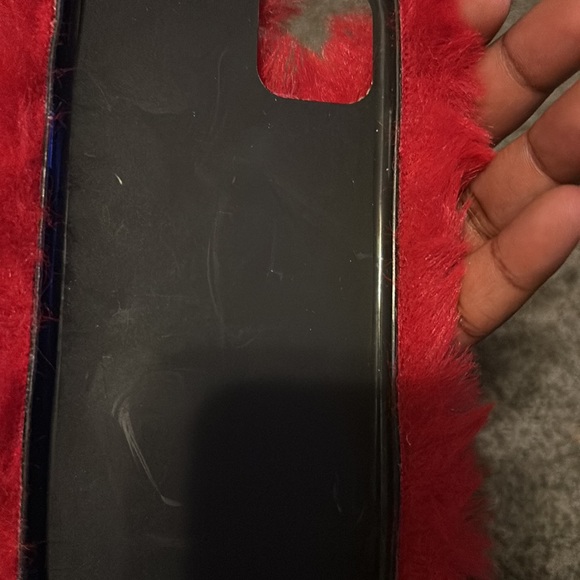 This is a fuzzy red case for a iPhone 11 pro max. There is a few little scratch. - Picture 3 of 4